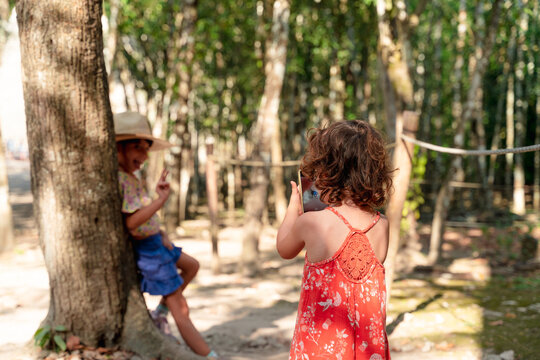 Girl taking travel selfies in Cob&aacute;, Mexico