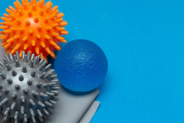 superclose of three small pilates balls on a gray elastic band
