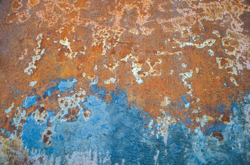 Rusty iron surface texture with white and blue color close up photo. Worn metal background

