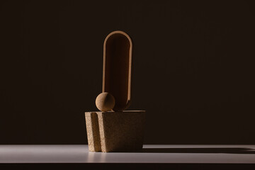 Still life of textured shapes in dark shadow