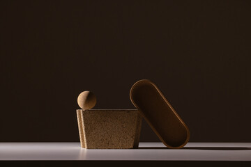 Still life of textured shapes in dark shadow