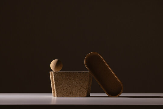 Still life of textured shapes in dark shadow