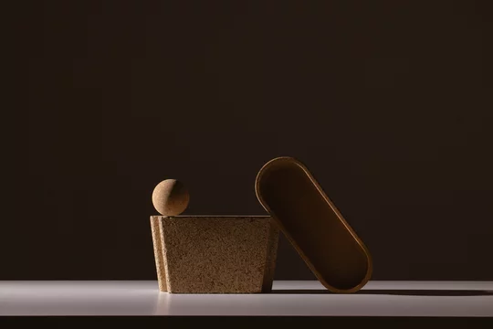 Still life of textured shapes in dark shadow