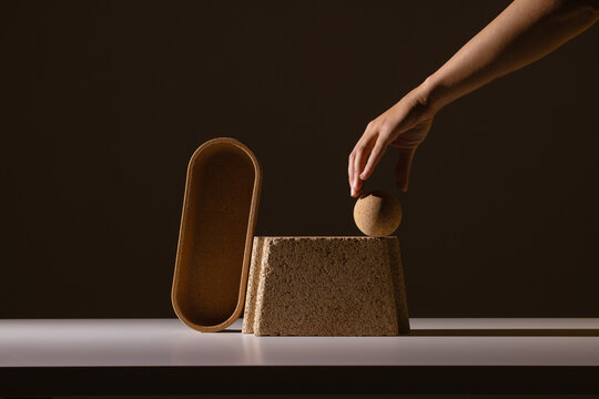 still life of architectural objects with hand reaching in 