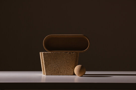 Still life of textured shapes in dark shadow