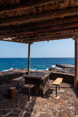 Fototapeta na wymiar Recreational area for barbecues at the Orchilla Pier on the southwest coast of El Hierro. Canary Islands