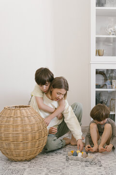 Mother and sons playing