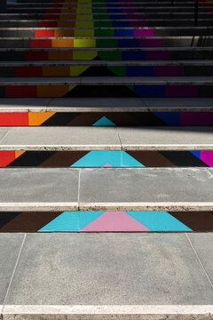 City stairs decorated with the colors of the LGBT flag