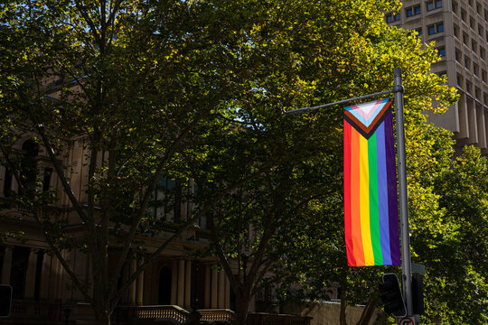 LGBT community flag hanging from a pole with copyspace