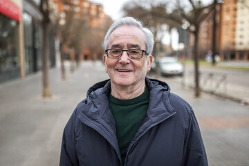 portrait of gray-haired old man outdoors