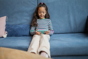 girl using mobile phone in a restaurant