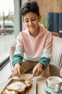 boy eating in a restaurant