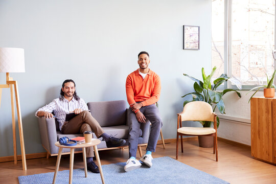 Cheerful multiracial coworkers in modern studio