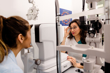 Female optometrist checking patients eyesight
