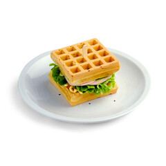 Belgian waffle sandwich with chicken, lettuce, tomato, cheese and mayonnaise. On a white background. Isolated.