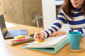 woman using laptop to study 