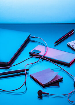 Office desk with scattered devices.