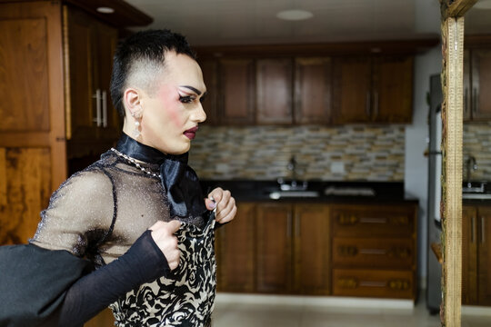 Drag queen adjusting her dress