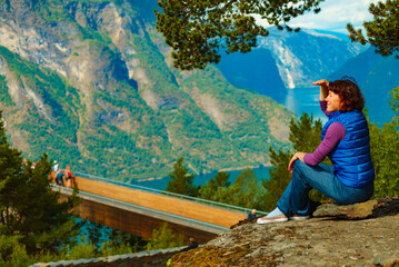 Tourist enjoying mountains fjord view, Norway