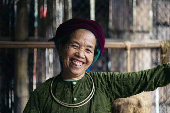 Portrait of an older Hmong woman in traditional clothing. Local people