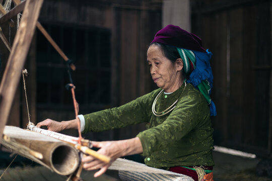 Traditional production: local weaver working with a loom in a workshop