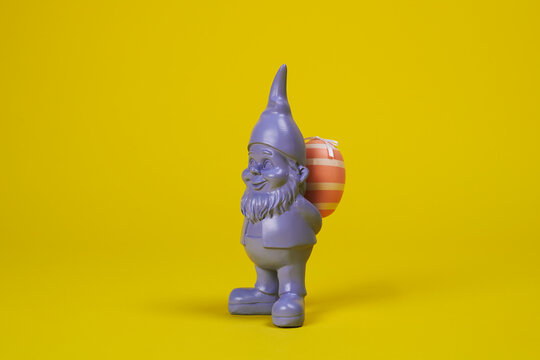 purple gnome with an easter egg in his back