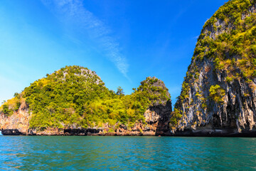 Fototapeta na wymiar Huge cliff rocks in azure water, Ko Rang Nok, Ao Phra Nang Beach, Ao Nang, Krabi, Thailand