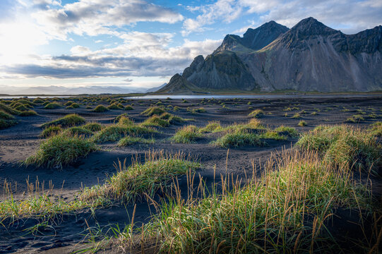 Amazing sunlight over the black sand dunes of Stokksnes, with Vestrahorn in the back, Iceland
