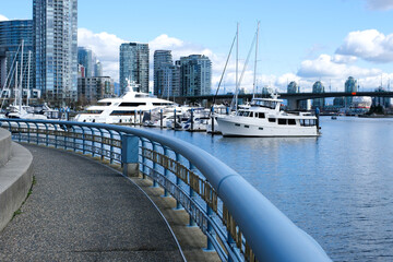 David Lam Park Yaletown spring pacific ocean jetty cyclists sun clear sky blossoming sakura cherry and magnolia trees sunny day seagulls fly rest weekend spend time with family vancouver canada 2023