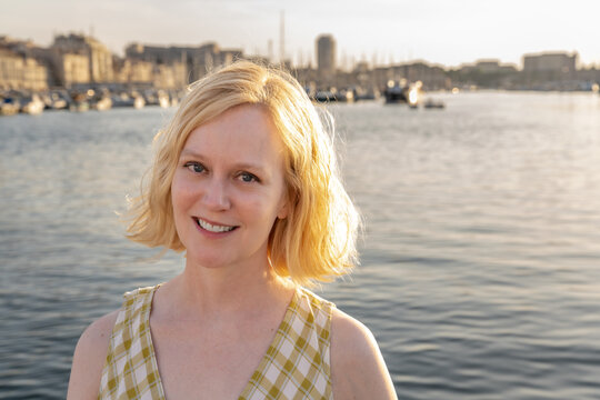 A woman enjoys traveling in Marseille, France, at the Old Port.