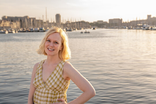 A woman enjoys traveling in Marseille, France, at the Old Port.