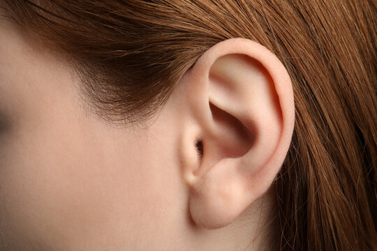 Closeup view of woman, focus on ear
