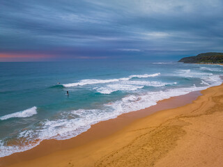 Aerial sunrise at the seaside with cloud cover