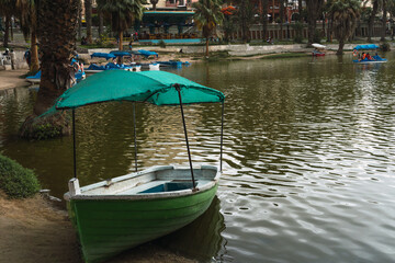 colored boat in the Huacahina lagoon, ica peru