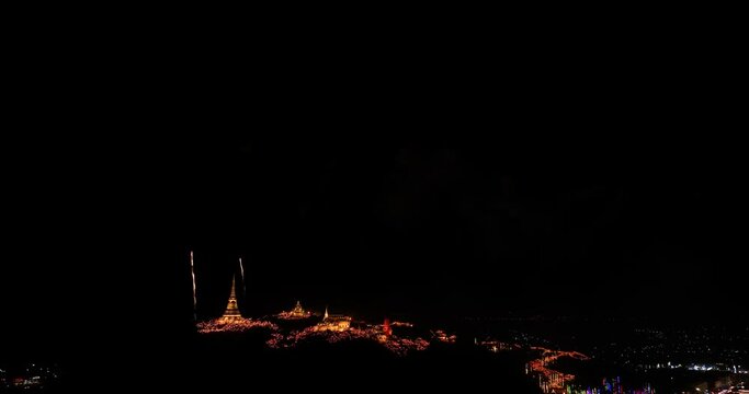 aerial view Stunning fireworks over the hilltop palace in the heart of Phetchaburi, Thailand. .Fireworks dazzling. Annual Festival of City Lights and Fireworks.decorative lights background.