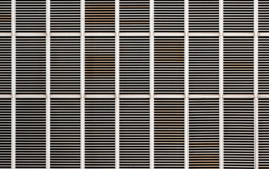 Metal air vent grill on the outside of a modern building