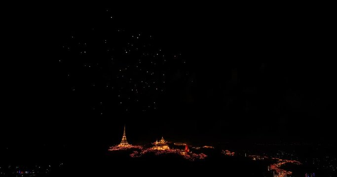 aerial view Stunning fireworks over the hilltop palace in the heart of Phetchaburi, Thailand. .Fireworks dazzling. Annual Festival of City Lights and Fireworks.decorative lights background.
