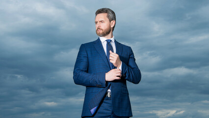 handsome man in suit outdoor. man in business suit. photo of man in suit. man in suit