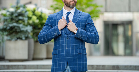 cropped view of business ceo on urban background. business ceo wearing jacket