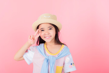 Image of Asian child posing on Pink background