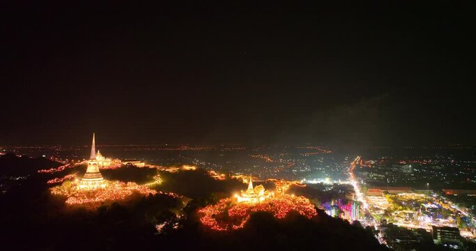 aerial view The lights decorate the palace and the pagoda at the top of the mountain at night, .beautiful and spectacular..An annual festival of city lights and fireworks..Colorful lights decorate .