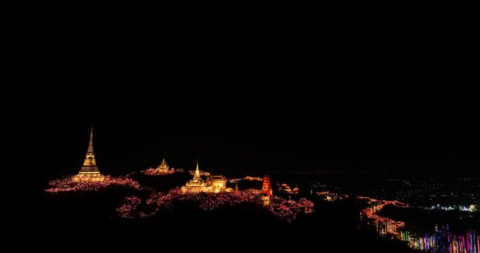 aerial view The lights decorate the palace and the pagoda at the top of the mountain at night, .beautiful and spectacular..An annual festival of city lights and fireworks..Colorful lights decorate .