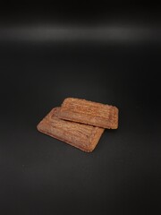 Brownie chocolate biscuits on black background