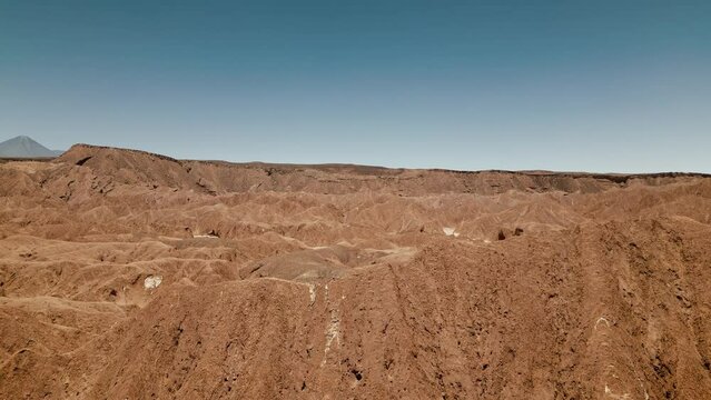 Witness the mesmerizing charm of Atacama's extraterrestrial-like landscape with stunning drone footage that showcases the rugged rocky formations and never-ending horizons of the desert.