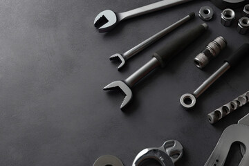 Obraz na płótnie Canvas Auto mechanic's tools on grey stone table with copy space