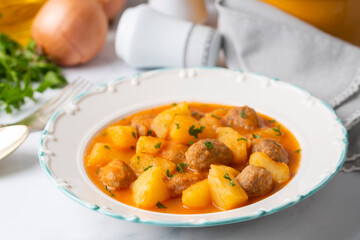 Potato dish with meatballs, Turkish name; koftleli sulu patates yemegi