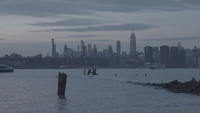 Panning Shot Across Hudson River Following Yacht With NYC Skyline In The Background - 4k - RAW