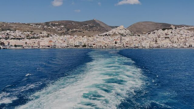 Syros island as seen from a ship departing from the seaport