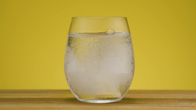 Concept painkiller, aspirin against headache, dissolve fizzy tablet in water