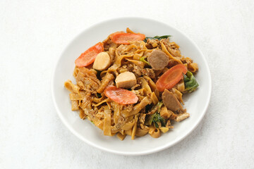 Kwetiaw or Kwetiau, fried rice noodles with meatballs and vegetables. Popular in Indonesia
